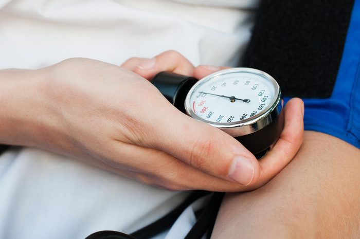 blood pressure gauge in hands