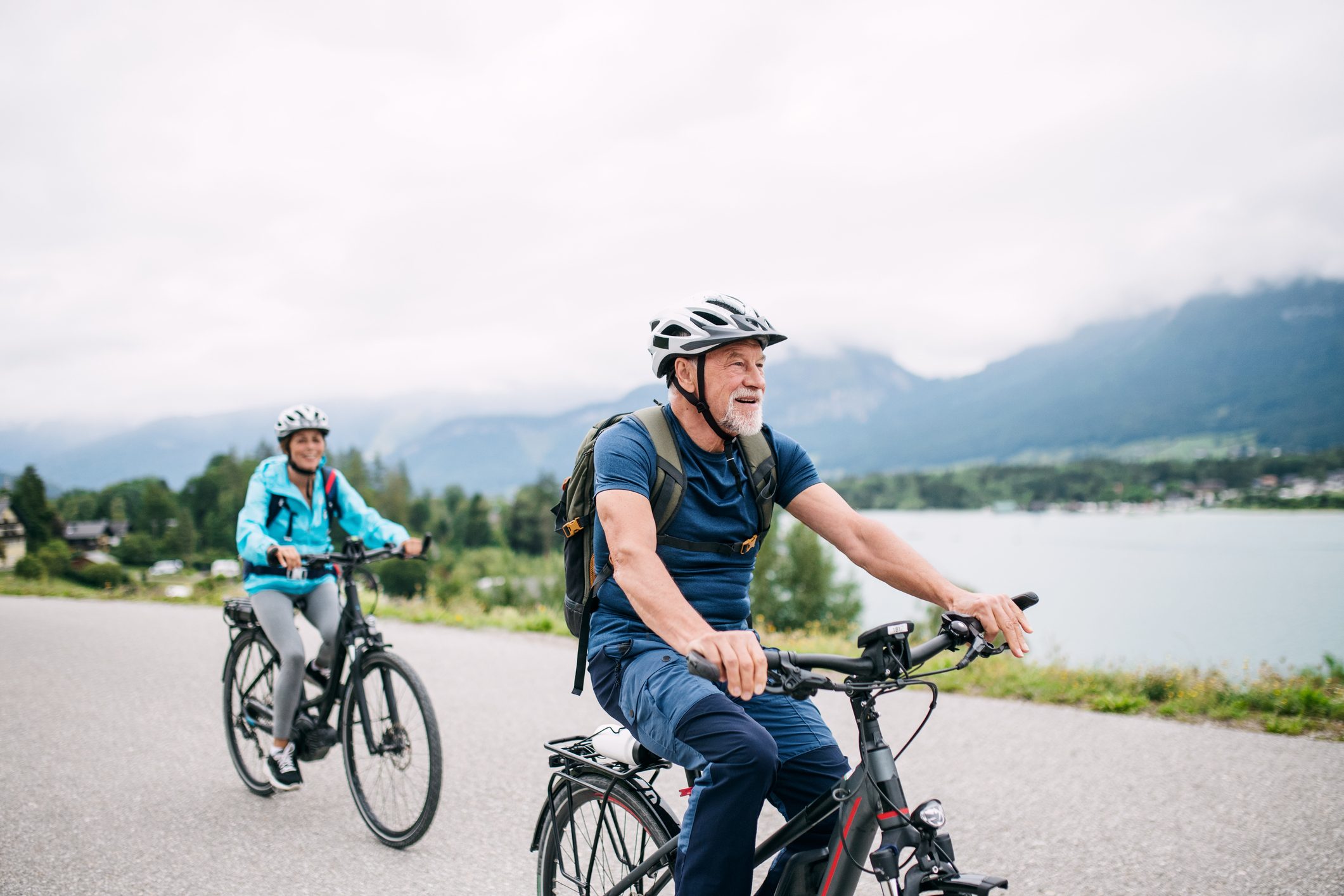 senior couple riding bikes outside for exercise