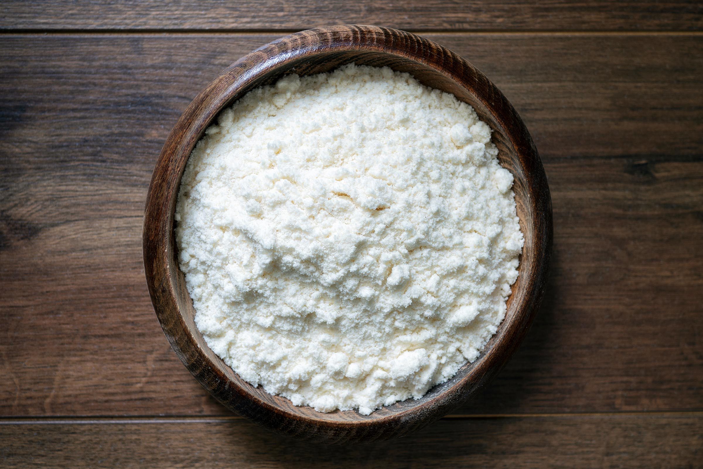 wooden bowl containing boric acid powder