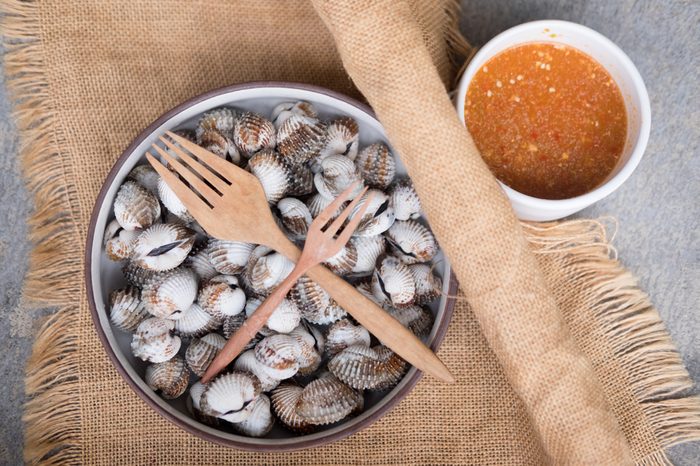 Bowl of clams with dipping sauce