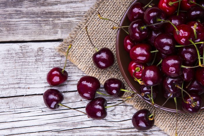 fresh cherries on wooden table