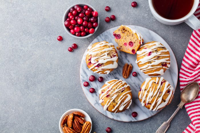 Muffins, cakes with cranberry and pecan nuts. Christmas decoration. 