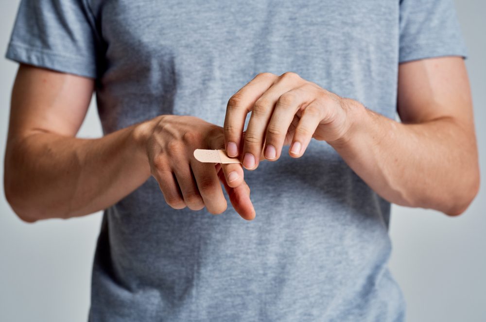 A man experiences pain in his fingers. 