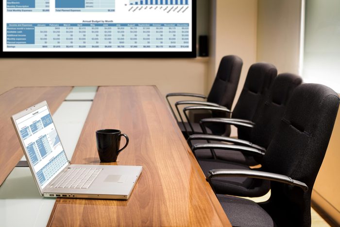 laptop in an empty conference room