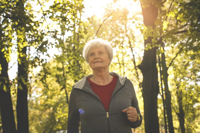 Smiling senior woman having recreation in park.