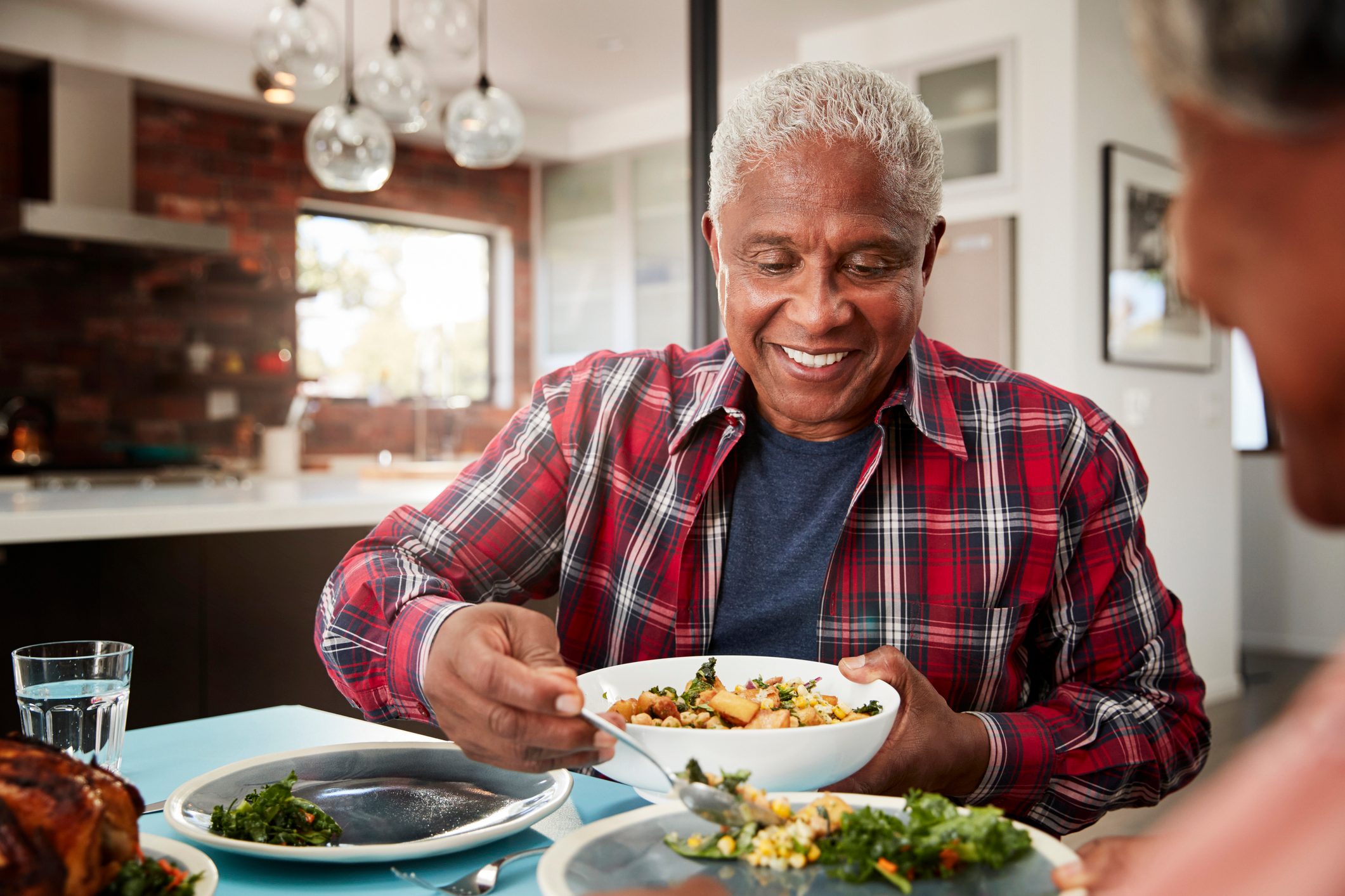 senior couple eating dinner at home