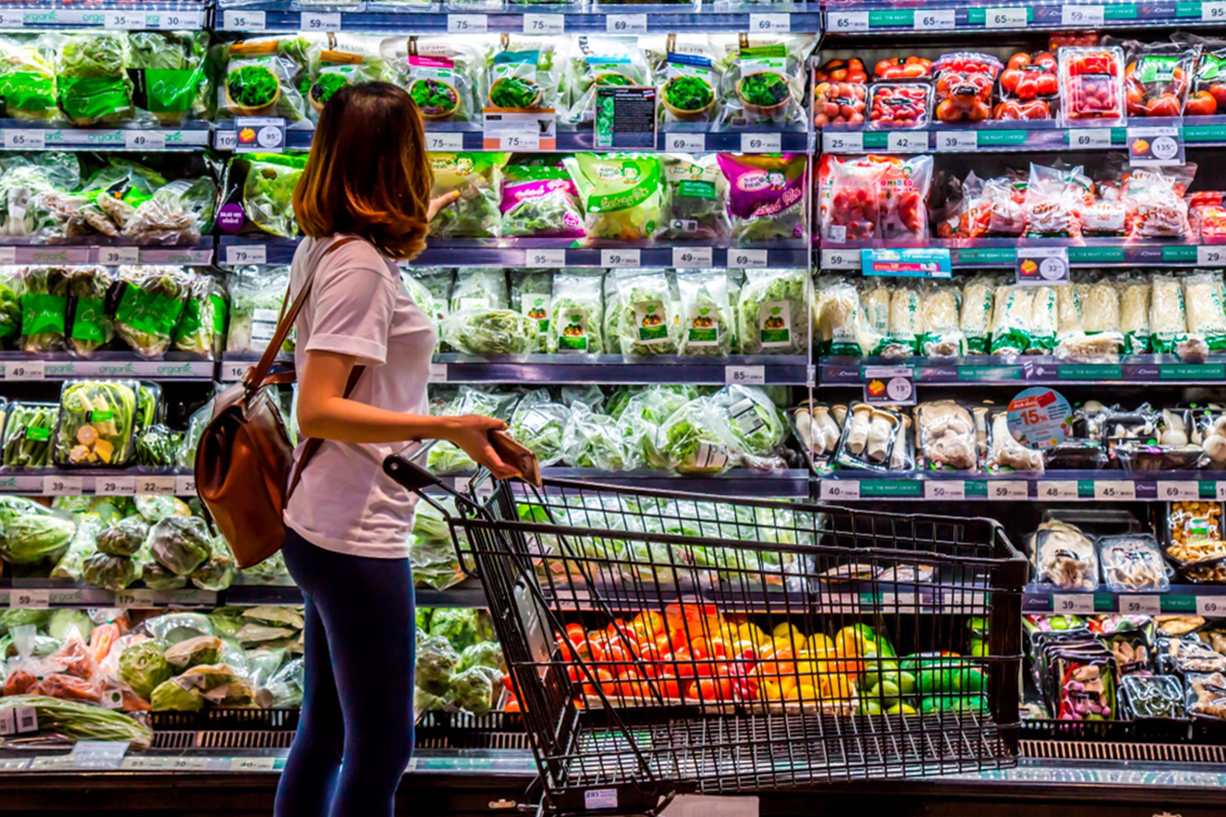 woman with cart in Grocery Store