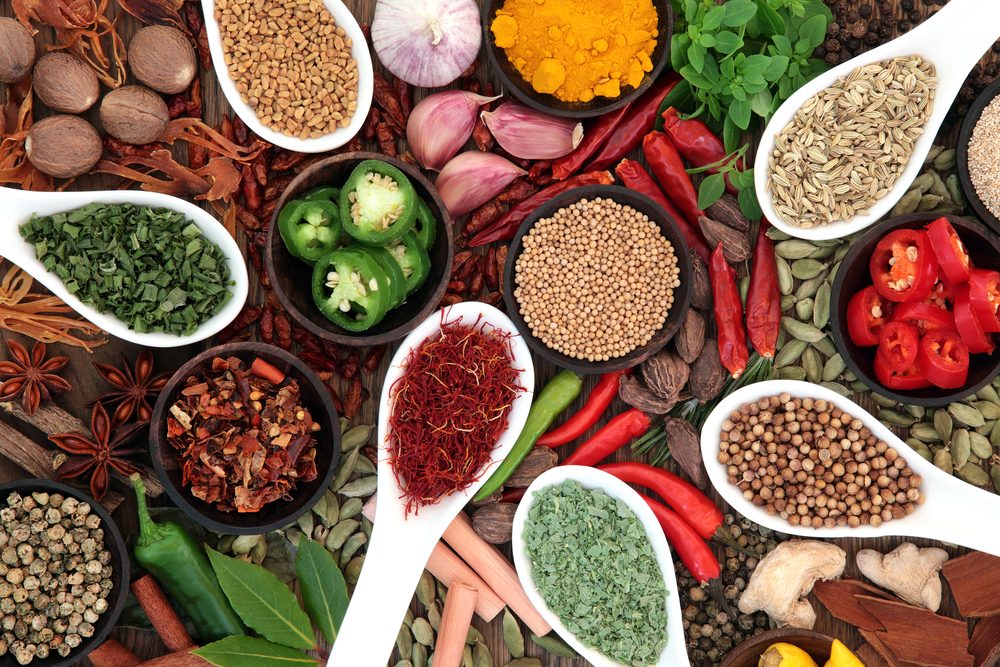 Large spice and herb collection in bowls and spoons