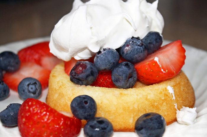 Fresh ripe blueberries and strawberries on a fat free sponge cake topped off with low calorie fluffy whipped cream