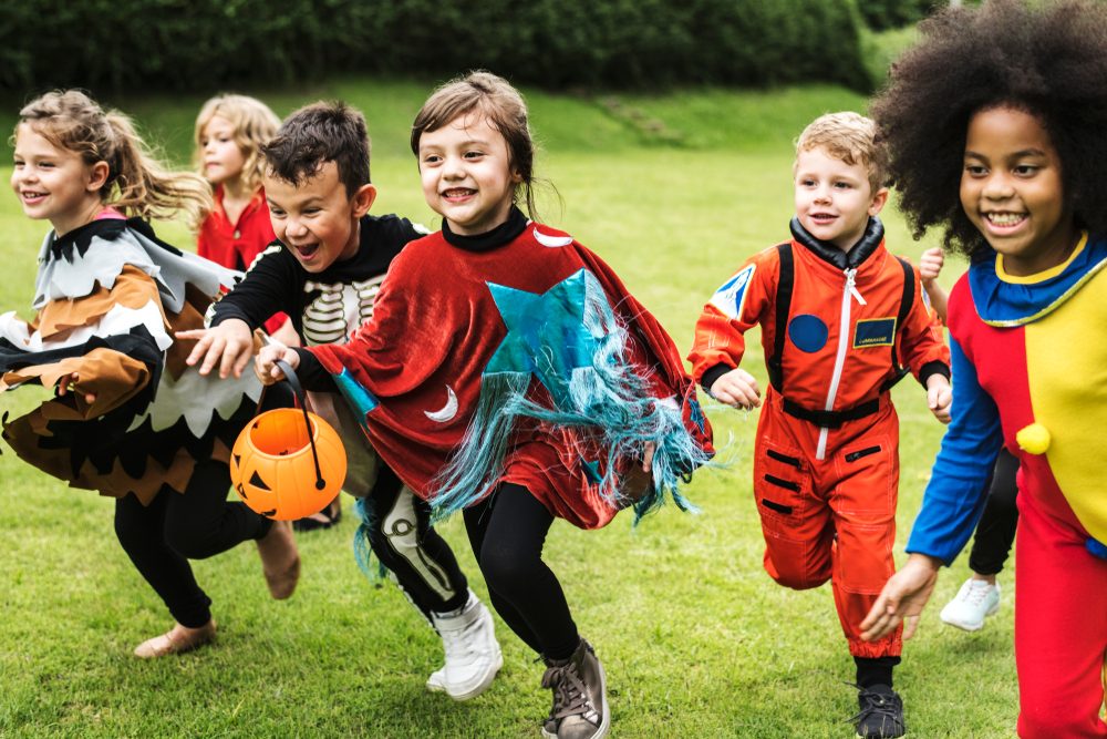 Little children trick or treating on Halloween