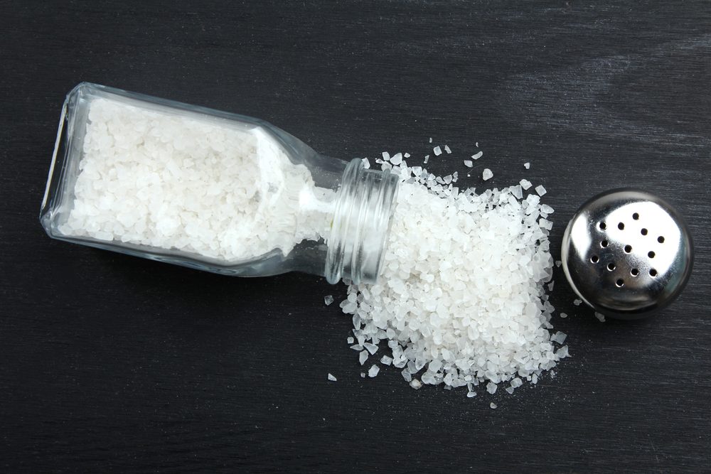 Sea salt on a black wooden background