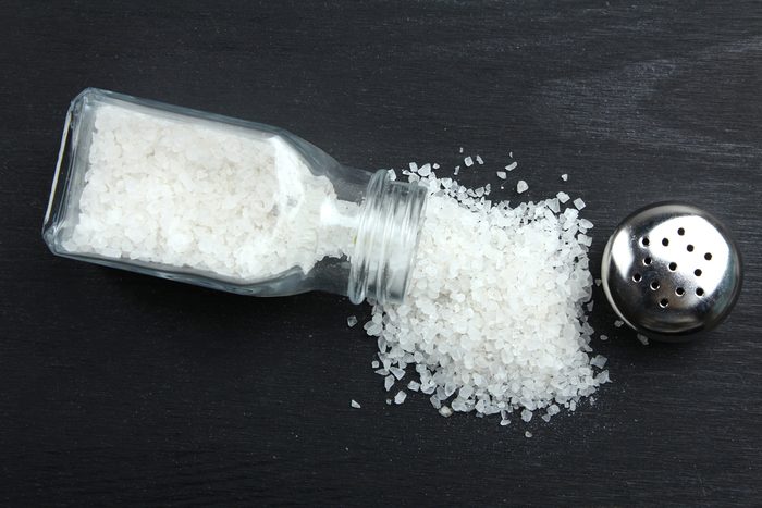 Sea salt on a black wooden background