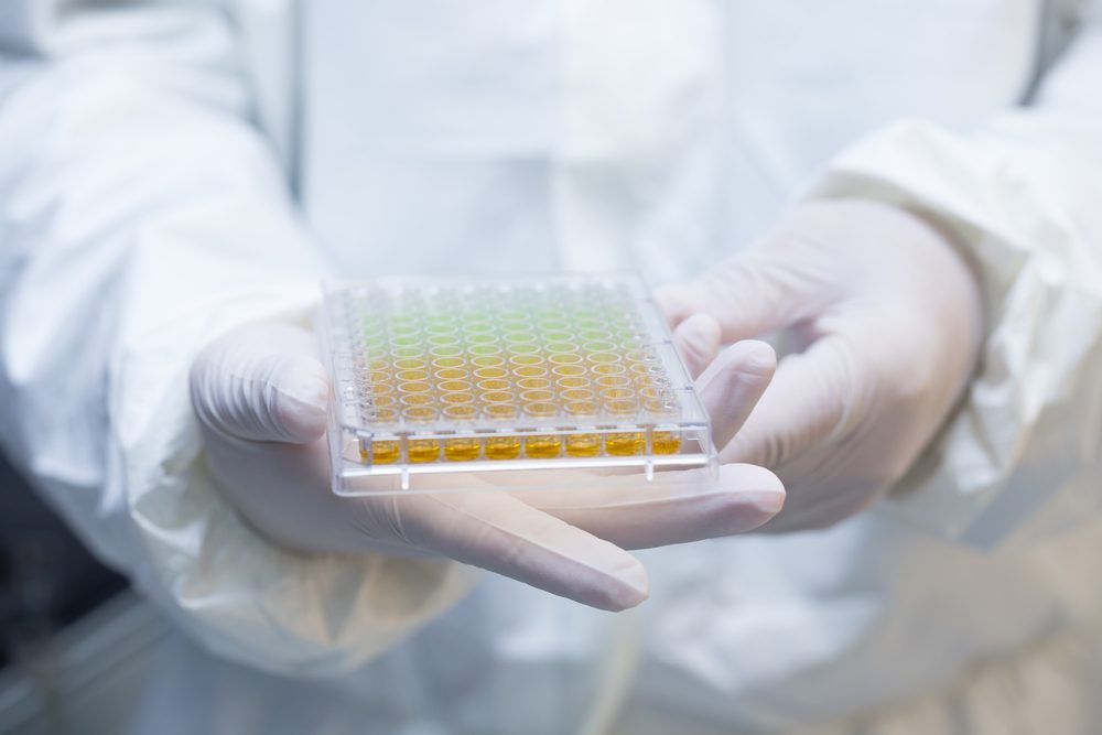 Scientists hold Various cell culture plates  so isolated in the laboratory.