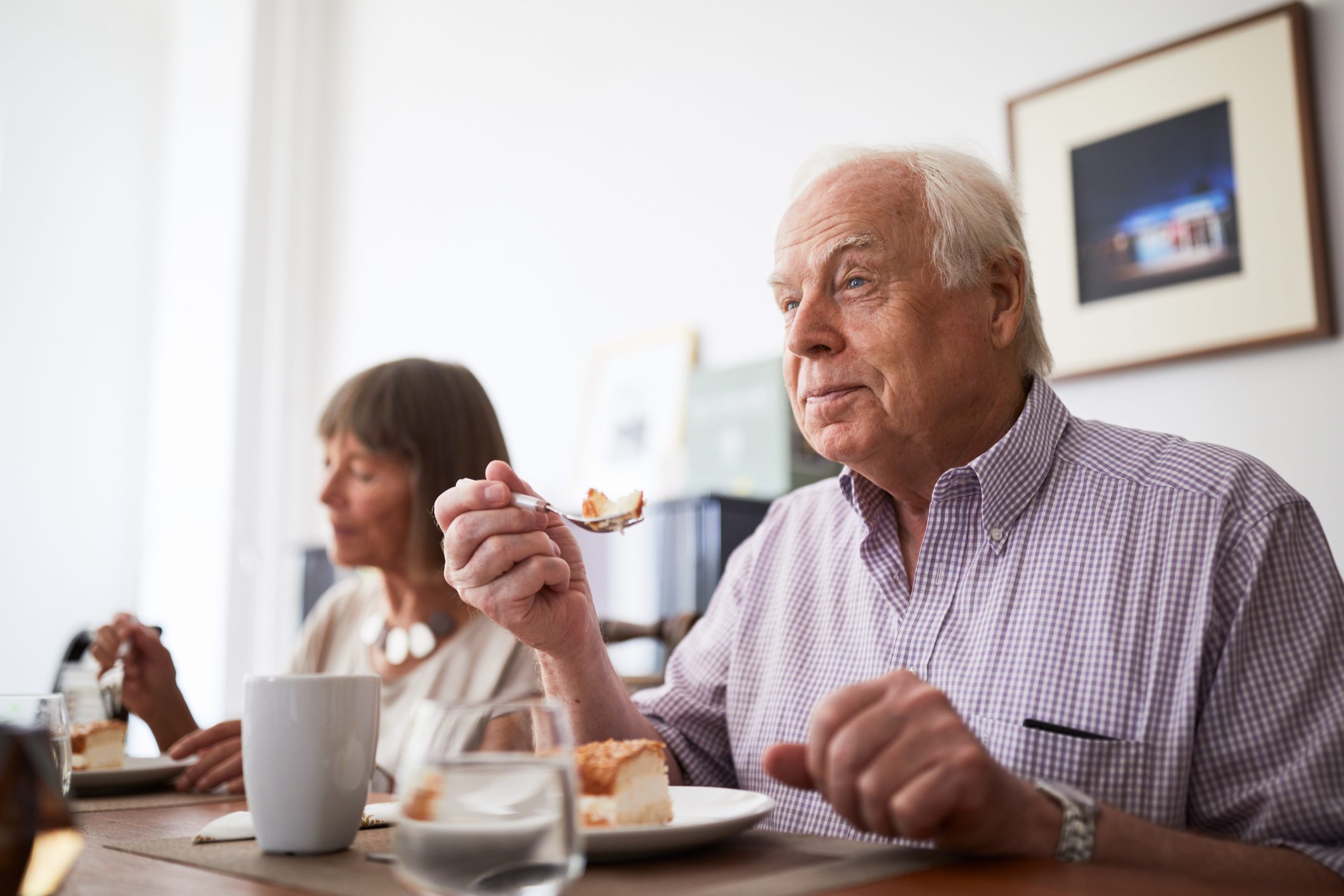 man eating with his family