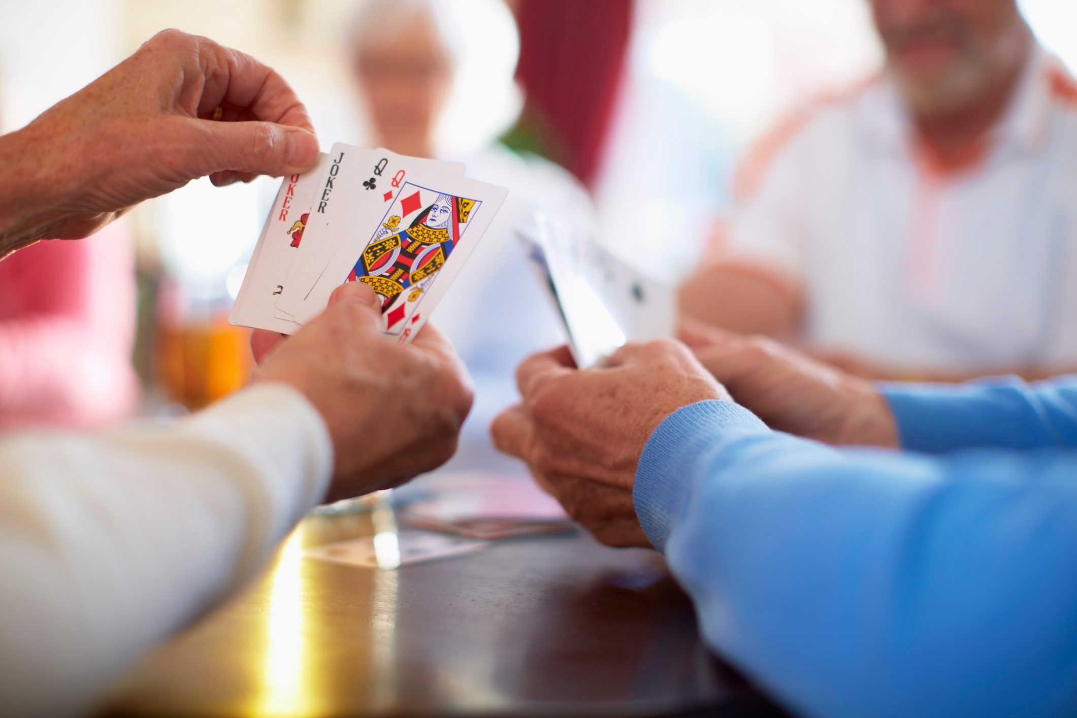 group of friends playing card games