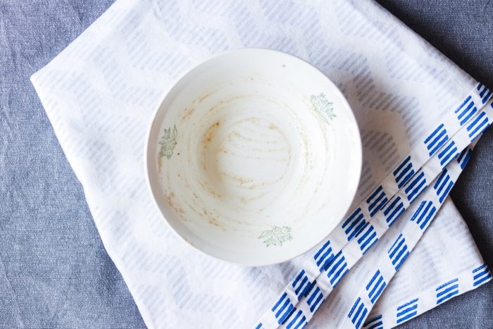 Empty dirty plate or dish. Finished food after lunch or dinner. Kitchenware concept good for restaurants, cafes or kitchen