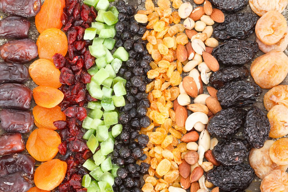 rows of different dried fruit: figs, apricots, cranberries, raisins