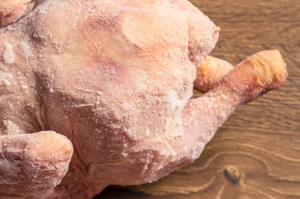 Frozen chicken from the refrigerator closeup