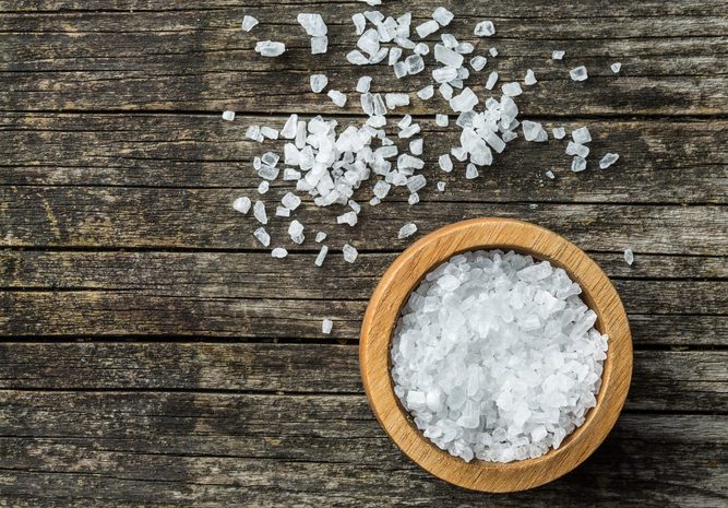 Sea salt in bowl. Top view.