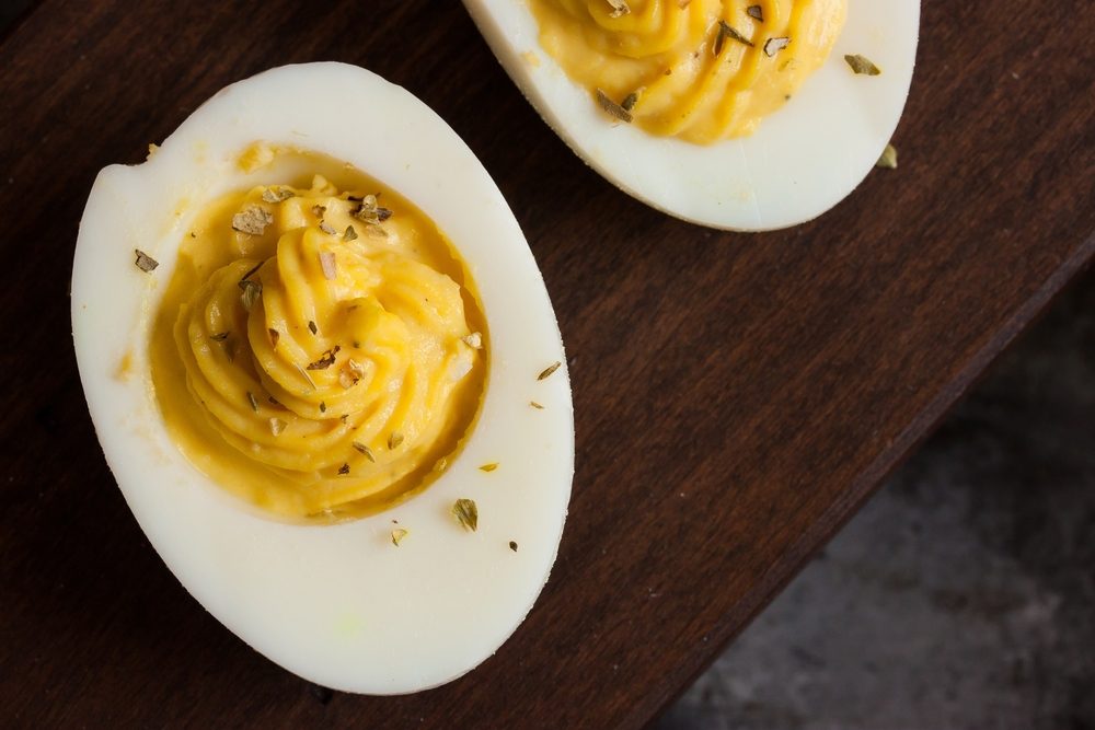 Deviled eggs on dark moody background