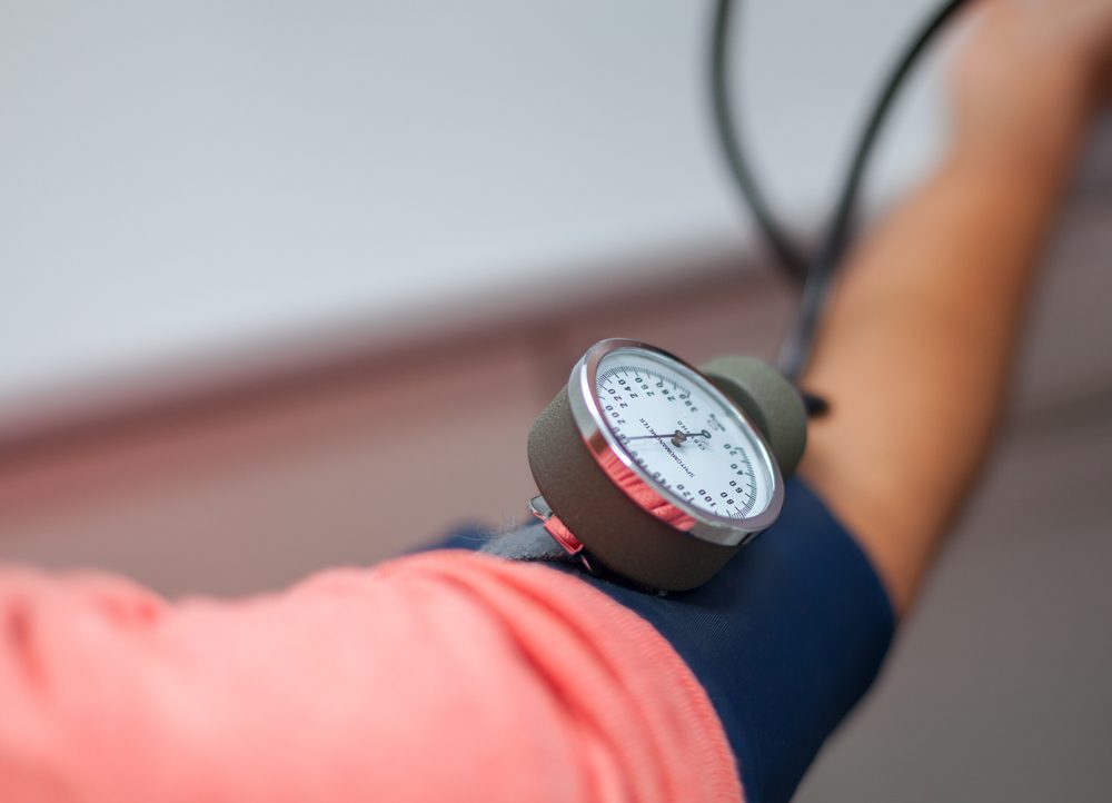 Doctor Checking Blood Pressure Of A Patient Close Up stock photo