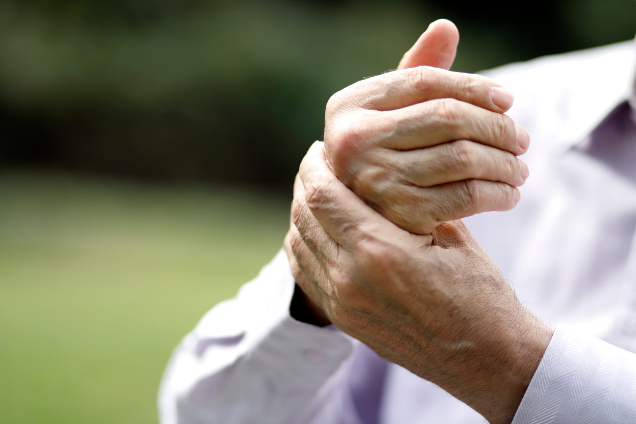 close up of man's hands with arthritis