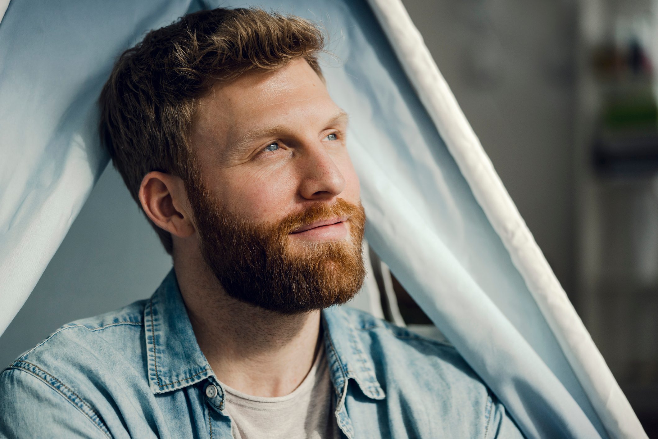 portrait of man with a beard smiling