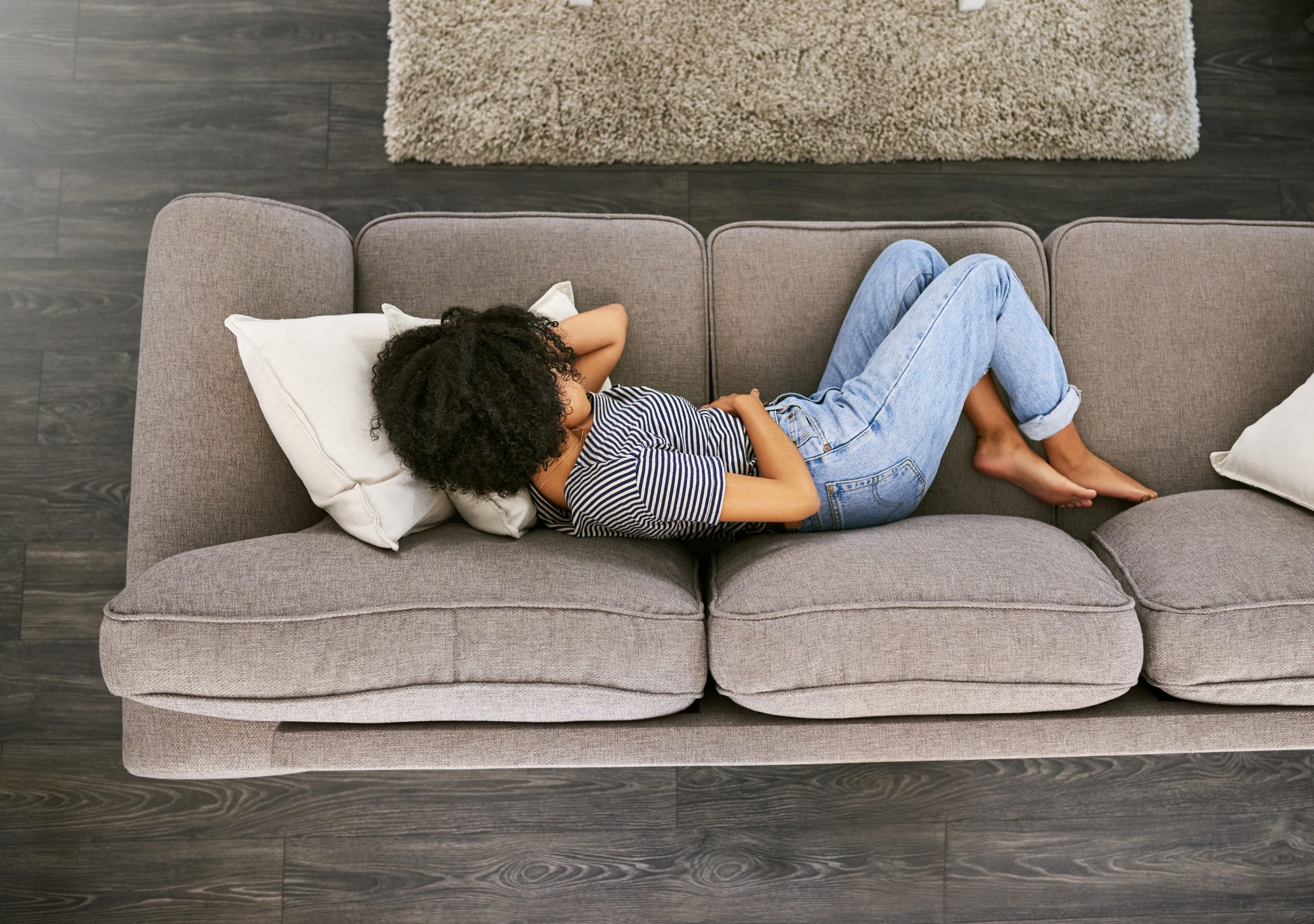 woman laying on couch