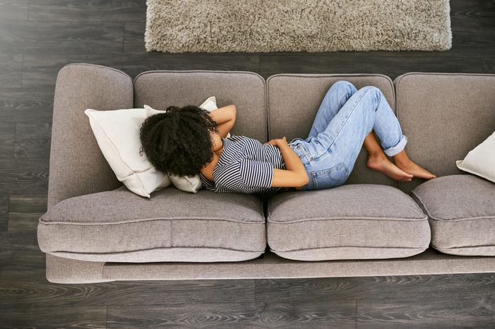 woman laying on couch