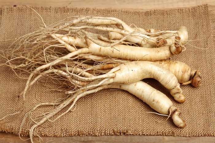 ginseng isolated on wood background