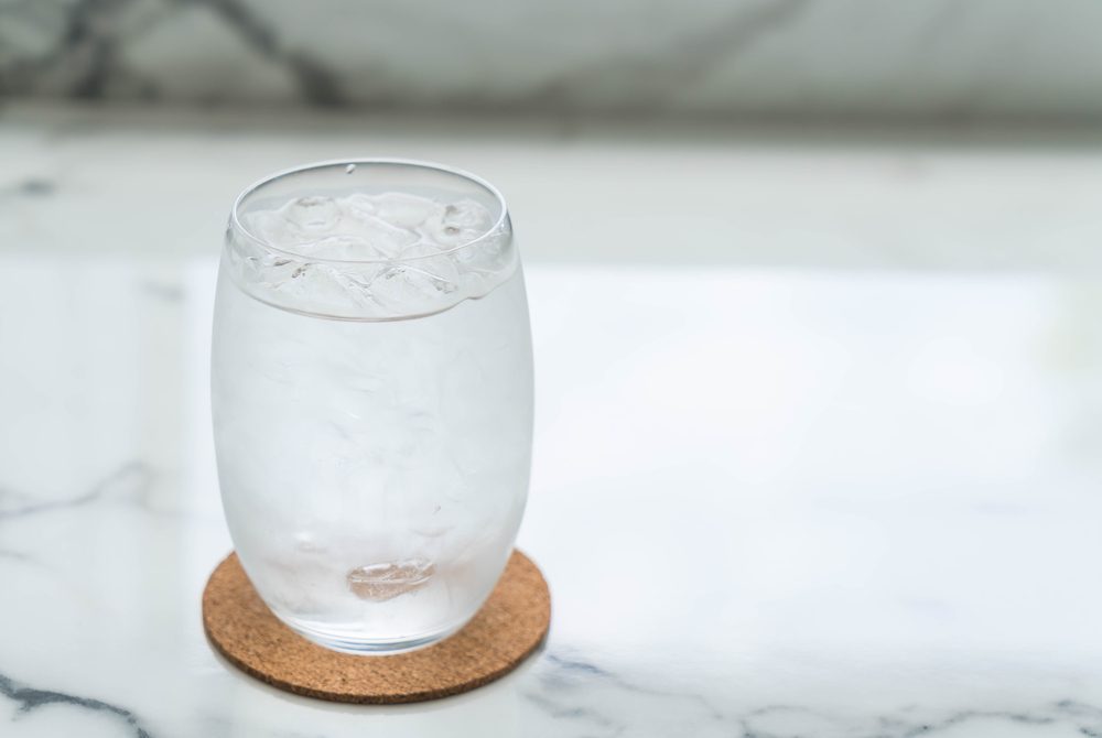 a glass of water with ice