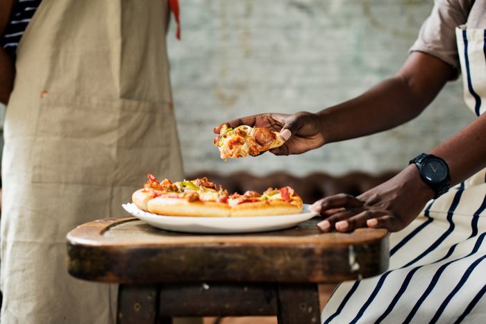 Couple eating pizza together