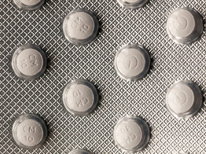 close up of back of foil tablet packet white pills; essex; england; uk