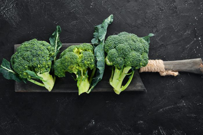 Broccoli. Fresh green broccoli on a black stone table. Top view. Free copy space.