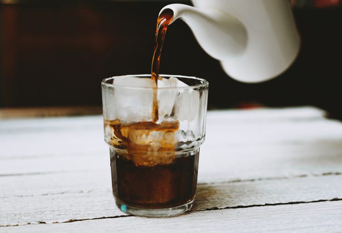 Coffee pouring in glass with ice, pour, breakfast,