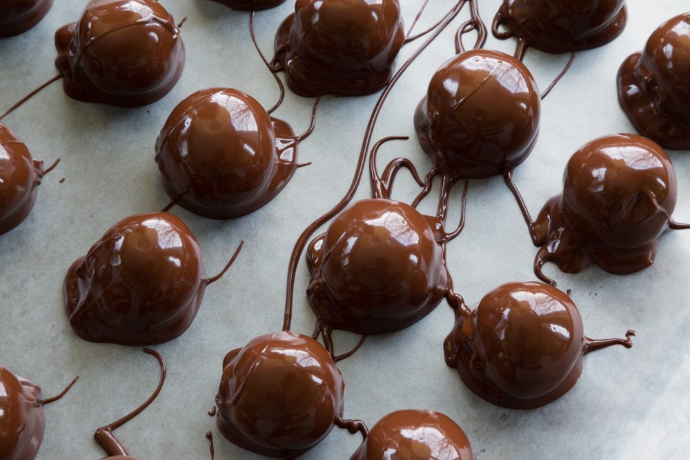 Freshly dipped homemade chocolate peanut butter balls.