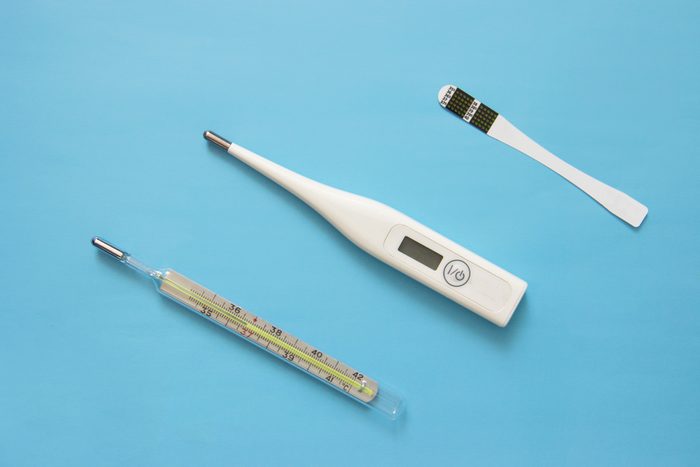 individual color dot oral thermometer, Glass mercury thermometer, digital thermometer on blue background