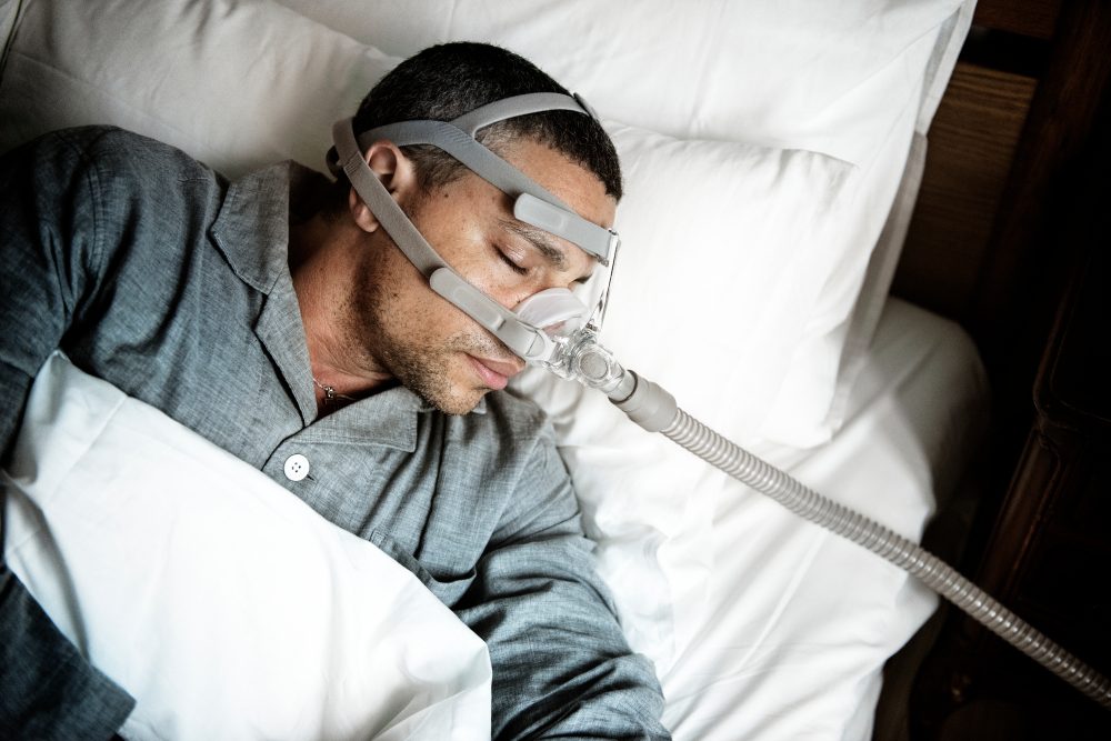 Sick man wearing an oxygen mask