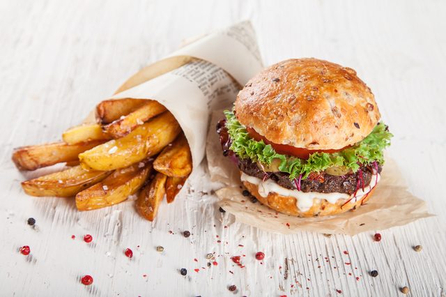 Close-up of home made burgers on wooden background