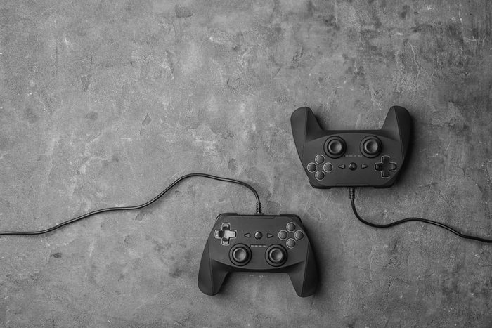Video game controllers on grey background