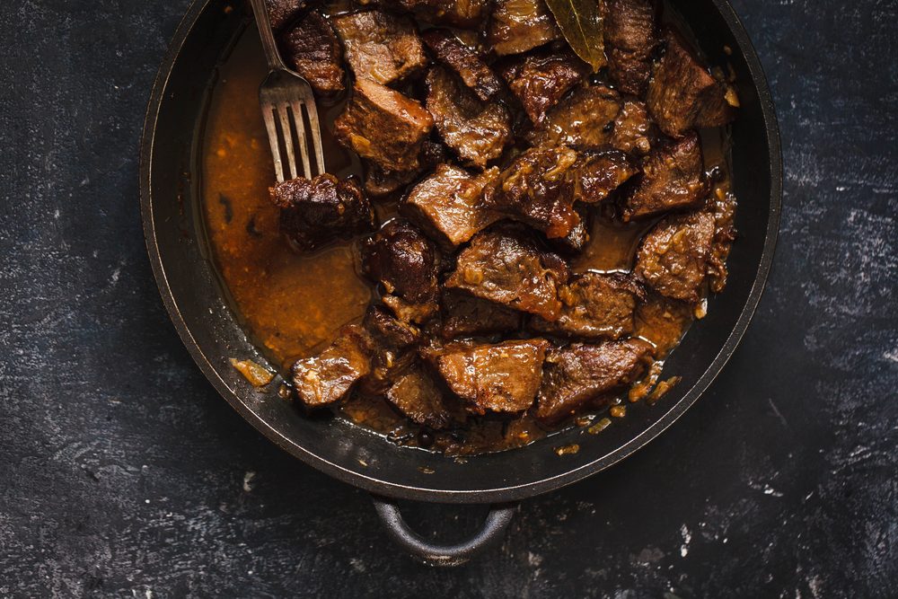 Beef meat stew. Overhead view braised beef meat stew with vegetables in pot.