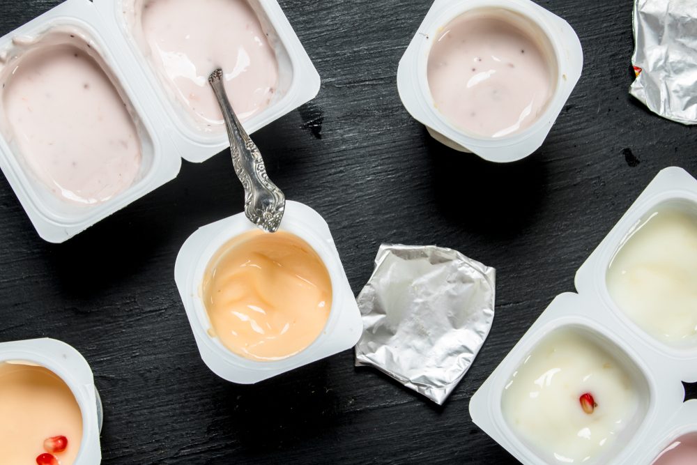 Yogurt with fresh fruit. On the black chalkboard.