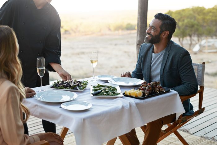 couple enjoying a romantic dinner while on vacation