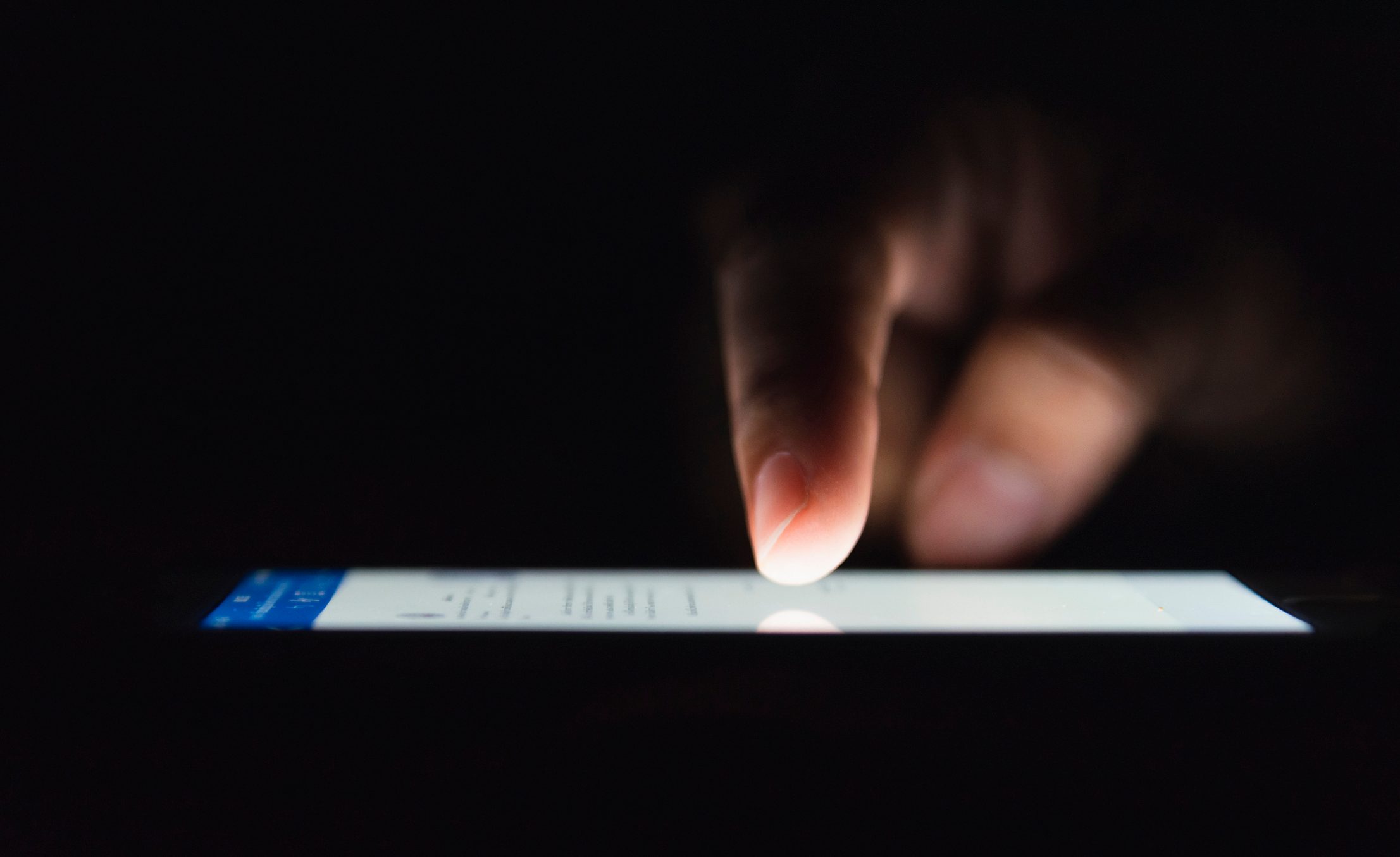 close up of phone screen lit up at night