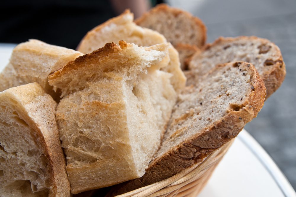 bread in basket - little roll breads in basket on table