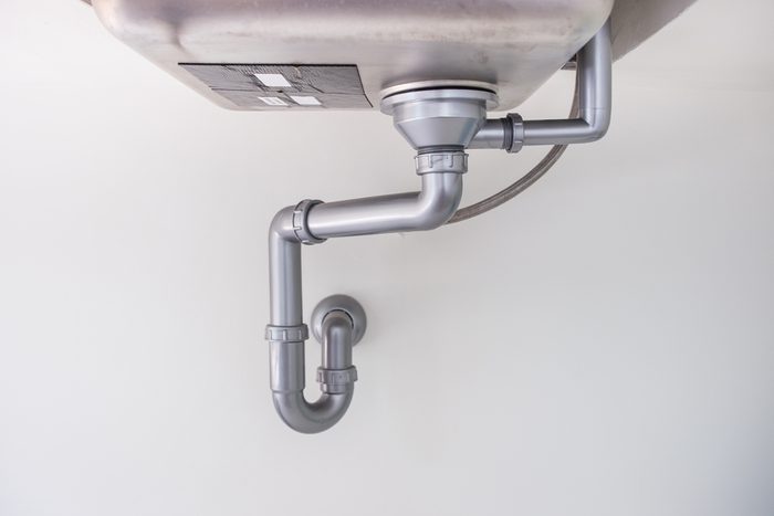 Dirty water pipe in kitchen.