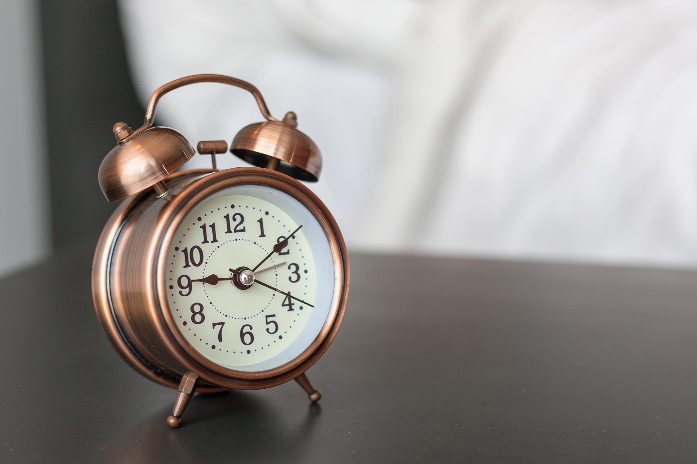 alarm clock on a bedstand