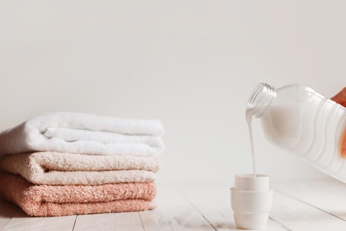 laundry detergent and folded towels