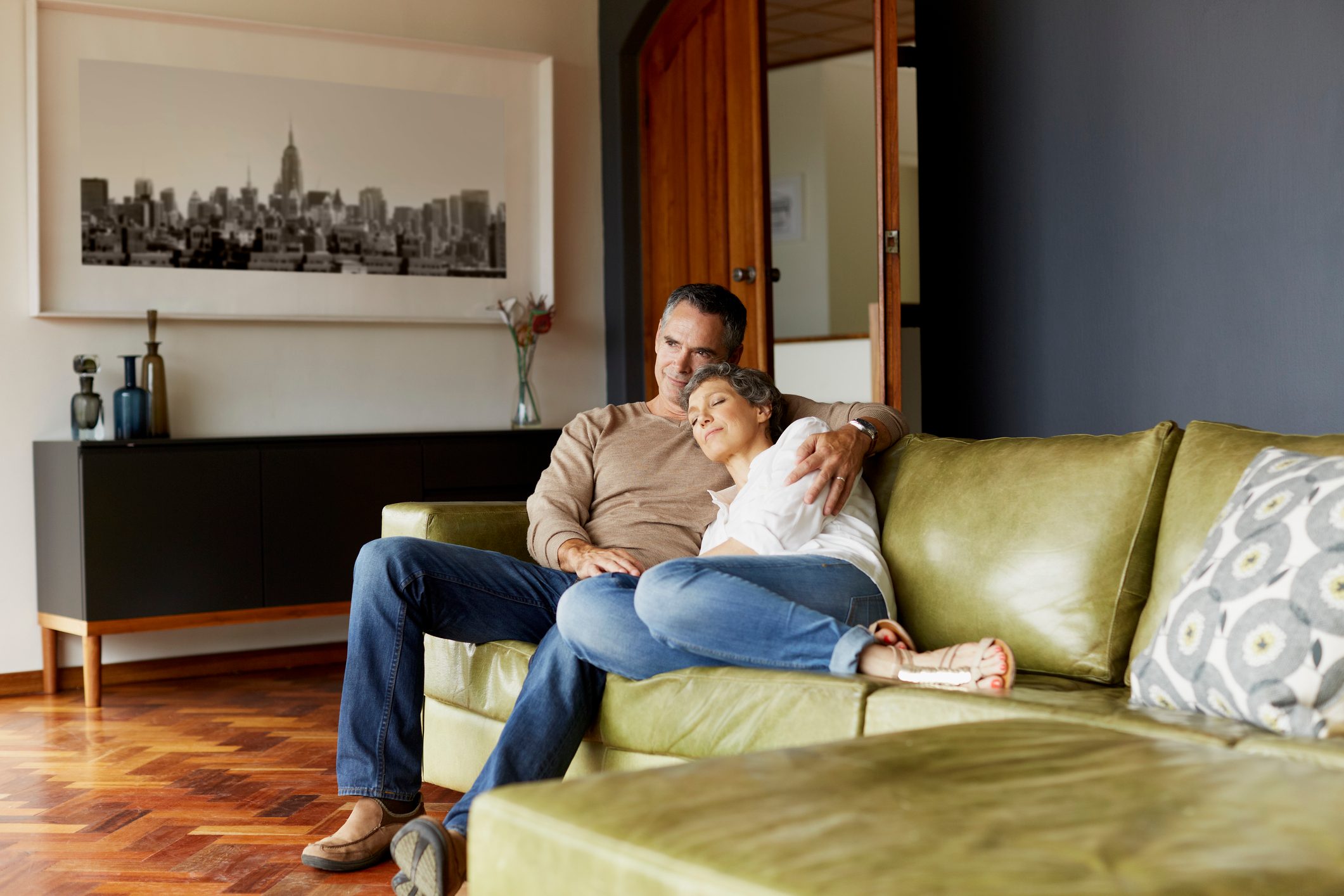 older couple sitting on the couch together at home