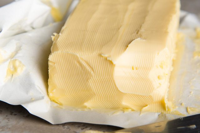 Large Softened Stick of Butter on Wrapping Ready to Eat; Shutterstock ID 171461966; Job (TFH, TOH, RD, BNB, CWM, CM): TOH